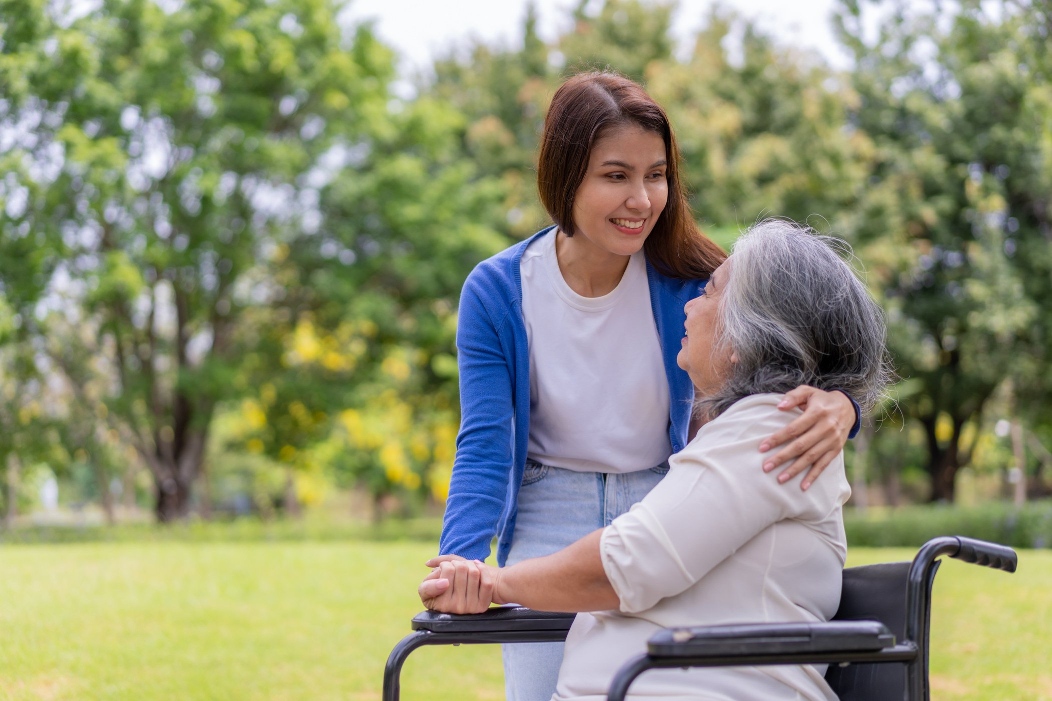 Asian careful caregiver or nurse hold the patient hand and e